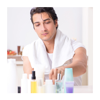 Image of person grabbing body care bottles