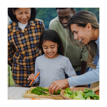 Image of a family chopping vegetables