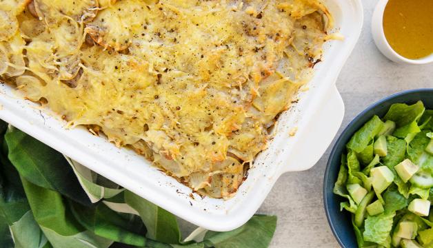 Natural Grocers Layered Potato, Cabbage, & Sausage Gratin Served with a Side Salad