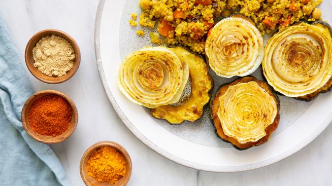 Natural Grocers Moroccan-Inspired Roasted Acorn Squash Served with Curried Quinoa Pilaf